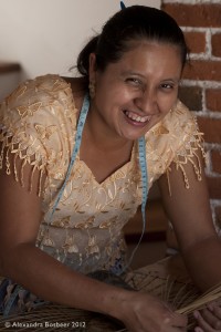 Guatemalan women making baskets as part of the Women's Day celebration at Thirteen Threads.